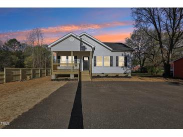 Charming single-story home featuring a welcoming front porch and well-maintained landscaping at 109 Faucette Ave, Burlington, NC 27215