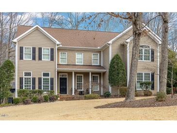 Traditional two-story home with a manicured lawn, neutral siding, and black shutters for a classic curb appeal at 116 Galway Dr, Chapel Hill, NC 27517
