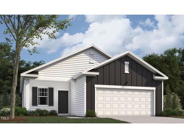 Charming single-story home featuring a two-car garage, white siding, and a well-maintained lawn at 135 N Keatts Winner Ct, Clayton, NC 27520