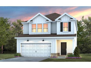 Two-story home with white siding, a brown roof, a two-car garage and a professionally landscaped yard at 2915 Huxley Way, Apex, NC 27502