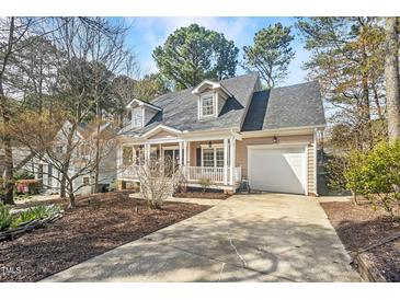 Charming home featuring a welcoming front porch and a one-car garage with a driveway at 308 Burnt Pine Ct, Apex, NC 27502