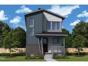 Charming two-story home with modern architectural design and a welcoming front porch at 50 Rainfall Dr, Pittsboro, NC 27312