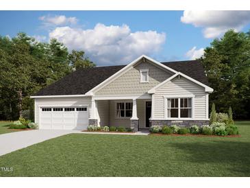Charming single-Gathering home with a two-car garage, lush lawn, and beautiful landscaping, creating great curb appeal at 84 Tee Time Ter, Benson, NC 27504