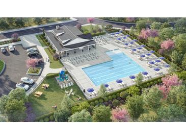 Aerial view of a community pool with lounge chairs, umbrellas, and a playground at 168 Kobus Ct, Garner, NC 27529