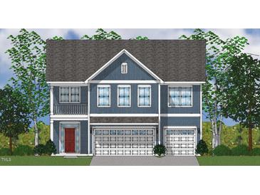 Charming blue two-story home with a two-car garage and a small balcony is surrounded by lush trees at 247 Augusta Pond Way # 164, Raleigh, NC 27603