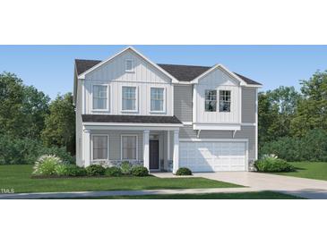 Charming two-story home featuring a gray and white exterior and a manicured green lawn at 0 Hanover Way, Sanford, NC 27330