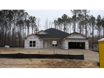 Unfinished exterior of a single-story home with a dark roof and an attached two-car garage at 1791 Pecan Drive # 22, Nashville, NC 27856