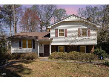 Charming two-story home featuring a classic exterior with a mix of siding and brick accents at 615 Sloan Dr, Cary, NC 27511