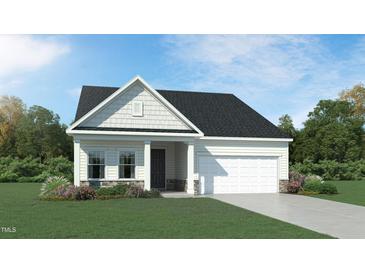 Charming single-story home with stone accents, attached garage and manicured lawn at 1502 Red Roses Ave, Durham, NC 27703