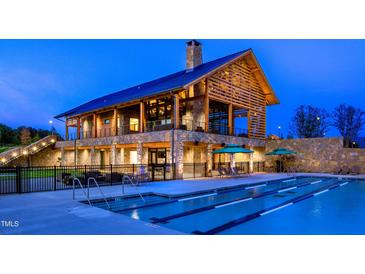 Stunning community clubhouse with an outdoor pool with lap lanes, perfect for relaxation and recreation at 1524 Level Stream Rd, Wendell, NC 27591