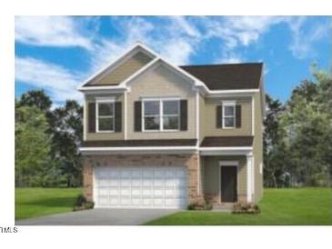 Charming two-story home featuring a two-car garage and neutral color palette at 209 E American Marigold Dr # 44, Benson, NC 27504