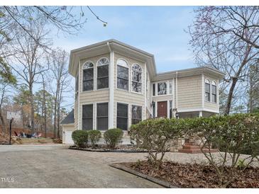 Charming home with a two-story entry and detailed trim, set in a landscaped yard, perfect for families at 104 Sierra Dr, Chapel Hill, NC 27514