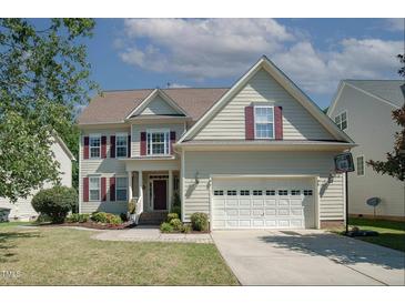Charming two-story home featuring a two-car garage and well-maintained landscaping at 400 Leacroft Way, Morrisville, NC 27560