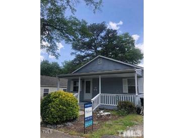 Charming single-story home featuring a well-manicured front yard and inviting entryway at 1111 Lancaster St, Durham, NC 27701