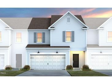 Charming two-story home with a front-entry garage and professional landscaping at 3502 Pelican Ln, Durham, NC 27703