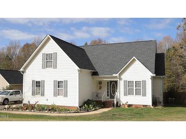 Charming two-story home with a well-maintained front yard and a classic design at 392 Travel Lite Dr, Raleigh, NC 27603