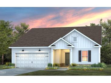 Charming one-story home with white siding, inviting entrance, attached garage and beautiful landscaped front yard at 780 Ben Ledi Ct, Raleigh, NC 27603