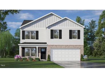 Charming two-story home with white siding, brick accents, black shutters, and a well-manicured lawn at 108 Pisgah St, Sanford, NC 27330