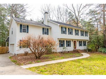 Charming two-story home featuring a well-manicured lawn and attached garage, perfect for families at 4324 Old Lewis Farm Rd, Raleigh, NC 27604