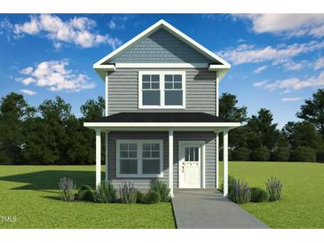 Charming two-story home with gray siding, white trim, covered porch, and beautiful landscaping at 136 Ambergate Ct, Rocky Mount, NC 27804