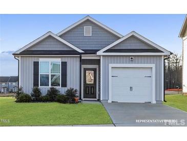 Charming single-story home with a gray facade, well-manicured lawn, and a one-car garage at 362 Bluejay St, Clayton, NC 27520