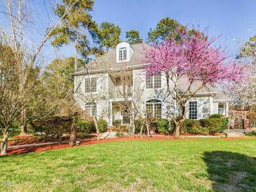 Charming two-story traditional home with manicured lawn and mature trees in a desirable neighborhood at 101 Sundance Pl, Chapel Hill, NC 27514