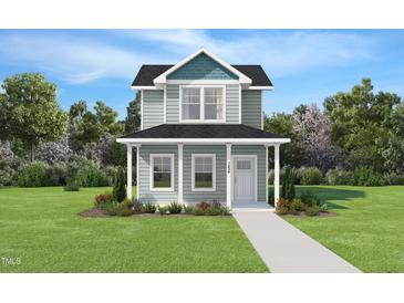 Charming two-story home with a welcoming front porch and beautiful landscaping at 133 Ambergate Ct, Rocky Mount, NC 27804