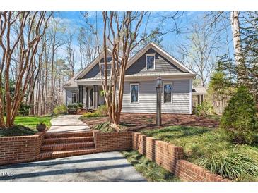 Charming home with landscaped yard, brick stairs, and craftsman style architectural details at 3120 A Timberlyne Dr, Mebane, NC 27302