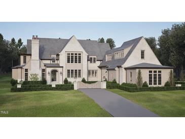 Charming exterior with a grey roof, a manicured lawn, and a private driveway at 4921 Foxridge Dr, Raleigh, NC 27614
