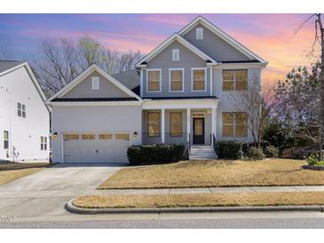 Charming two-story home with manicured lawn and attached two-car garage at 104 Bailey Park Ct, Cary, NC 27513