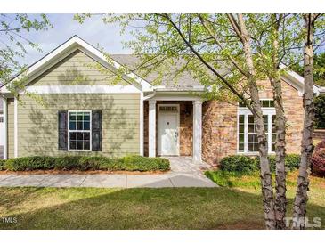 Charming home featuring stone accents, light green siding, and a welcoming front entrance at 1503 Orchard Villas Ave, Apex, NC 27502