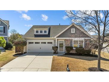 Charming home featuring stone accents, an attached two-car garage, and a well-manicured lawn at 2914 Lake James Dr, Fuquay Varina, NC 27526