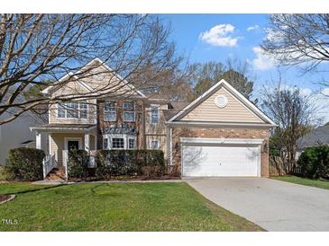 Traditional two-story home with brick and siding exterior and an attached two-car garage at 4619 Paces Ferry Dr, Durham, NC 27712