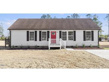 Charming single-story home showcasing a red front door and a well-maintained lawn at 176 Clear Water Dr, Smithfield, NC 27577