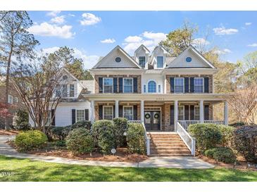 Beautiful two-story brick home with a large front porch and well-manicured landscaping at 3504 Griffice Mill Rd, Raleigh, NC 27610