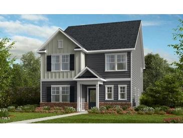 Charming two-story home with a combination of gray siding and board and batten at 1065 Hardin Hill Ln, Knightdale, NC 27545