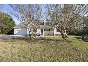Charming single-Gathering home with a well-maintained lawn and attached garage at 63 Halter Ct, Angier, NC 27501