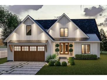 Charming two-story home showcasing a modern design, meticulous landscaping, and a welcoming entrance at Lot 21H Good Shepherd Trl, Spring Hope, NC 27882