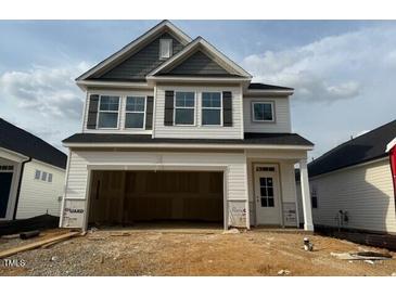 New construction two story home with attached garage and neutral color palette at 104 Fairwinds Dr, Lillington, NC 27546