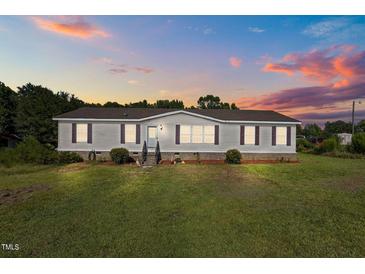 Charming single-story home with well-maintained lawn and classic curb appeal at 2751 Old Fairground Rd, Angier, NC 27501