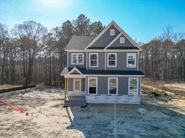 New two-story home with gray siding, white trim, and traditional architectural details at 452 Duncan Creek Rd # 156, Lillington, NC 27546