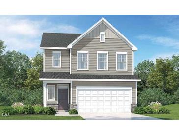 Charming two-story home with gray siding, attached garage, and landscaped front yard at 716 Shea Hill Dr # 50, Angier, NC 27501