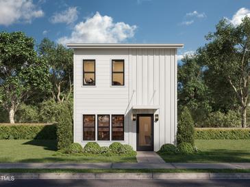 Charming modern two-story home with vertical siding and manicured landscaping at 2600 Fayetteville St, Durham, NC 27707
