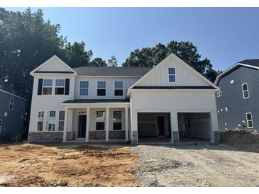 New two-story home featuring a two car garage, covered porch, and craftsman style architectural details at 740 Portland Rose Dr, Knightdale, NC 27545