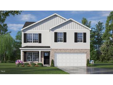 Charming two-story home featuring a brick foundation, black shutters, and a well-manicured lawn at 1100 Ursa Major Ct, Wendell, NC 27591