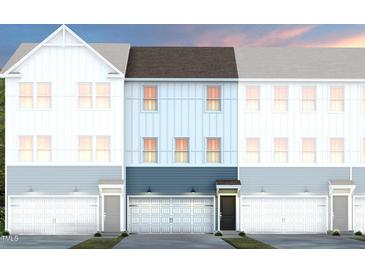 Modern townhome showcasing varied exterior paint colors and attached one car garage at 1513 Tamarisk Ln, Durham, NC 27703