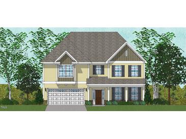 Charming two-story home featuring a symmetrical facade, a well-maintained lawn, and professionally-landscaped yard at 331 Augusta Pond Way # 173, Raleigh, NC 27603