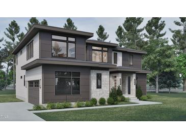 Modern home with mixed siding, large windows, and well-manicured landscaping at 3908 Cedar Knolls Dr, Youngsville, NC 27596