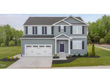 Charming two-story home featuring a two-car garage, tasteful siding, and well-maintained landscaping at 225 N Coral Bells Way, Four Oaks, NC 27524