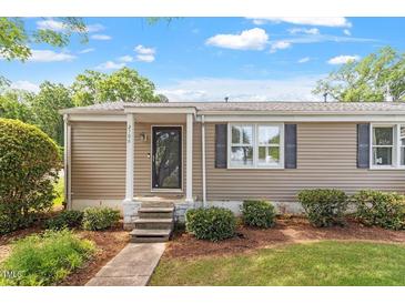 Charming single story home with a well-maintained lawn and nicely trimmed hedges at 2706 Mcneil St St, Raleigh, NC 27608